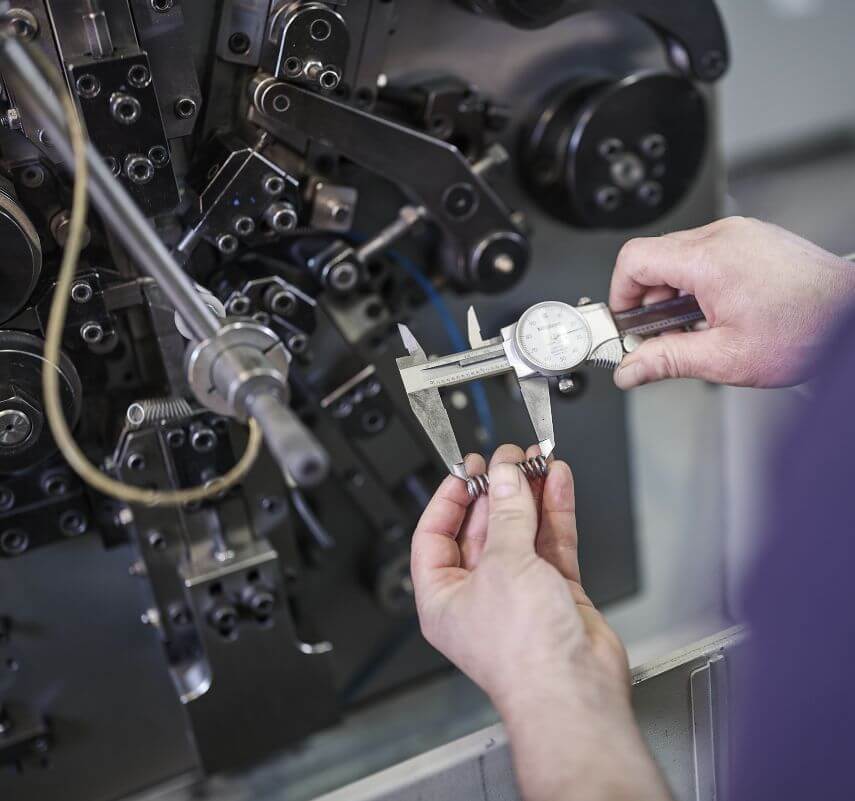 Spring measurement with calipers